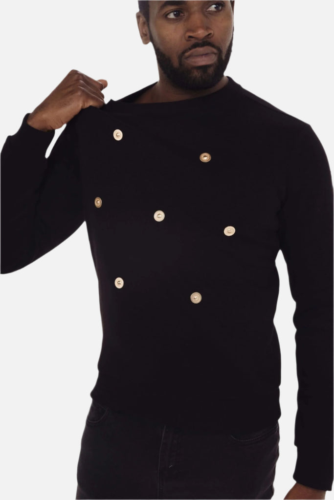 black jumper with gold buttons